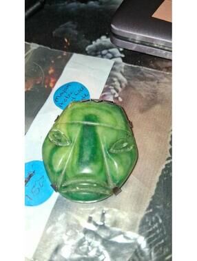 Mayan aztec god face in jade brooch